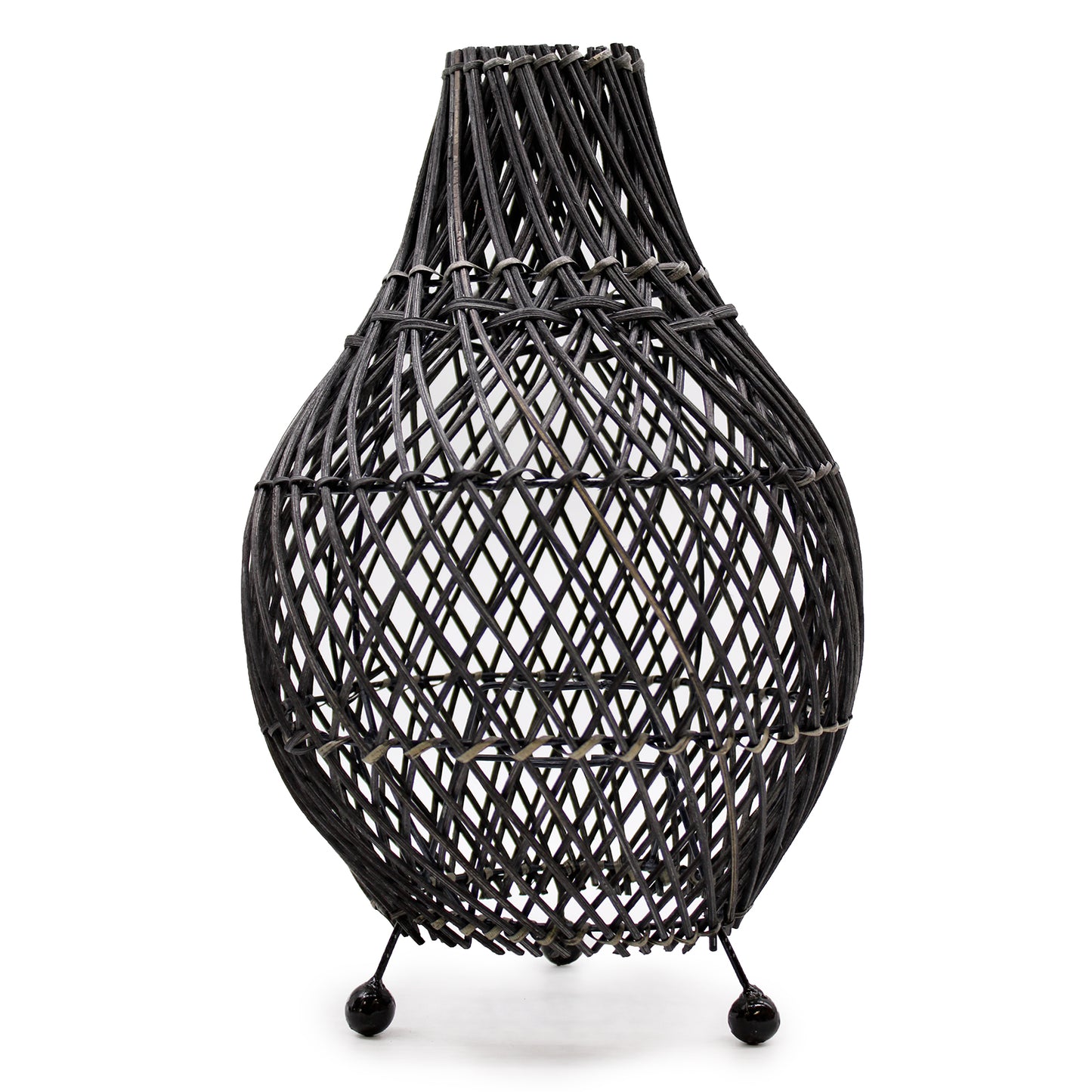 Black rattan table lamp with curved shape and metal feet, styled on white background for contemporary interiors.