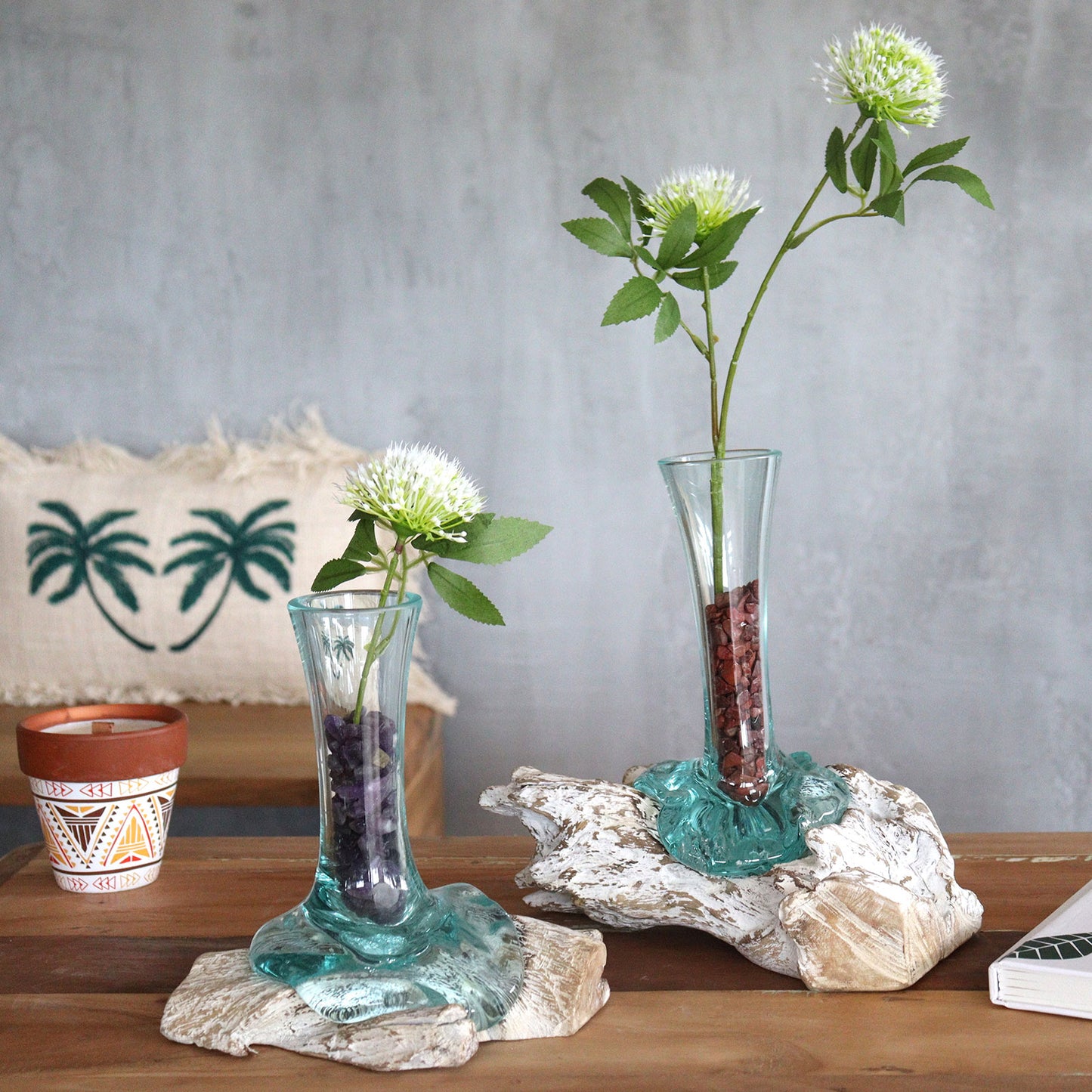Set of two whitewashed wood glass vases styled with tea, cups, and boho accents on a wooden table for a cozy natural interior.