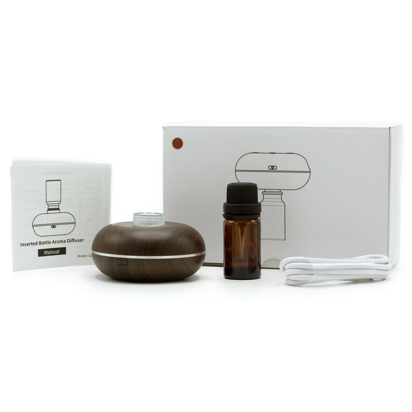 Top view of compact diffuser and oil bottle, showcasing minimal design and lightweight form factor for easy portability