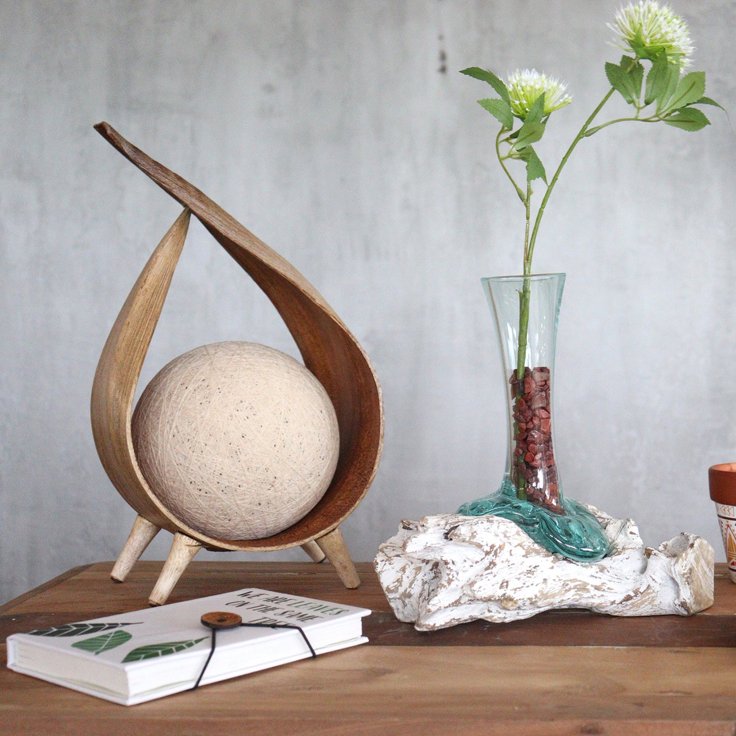 Molten glass vase with greenery styled on a desk beside boho decor and books, perfect for earthy interiors.