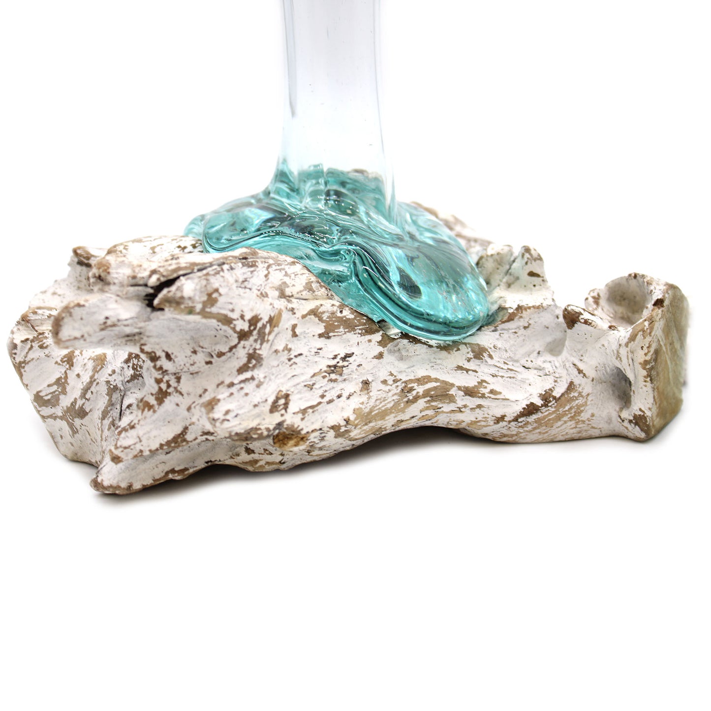 Close-up angled view of molten glass vase formed over light wood, showcasing texture and artisan fusion of materials.