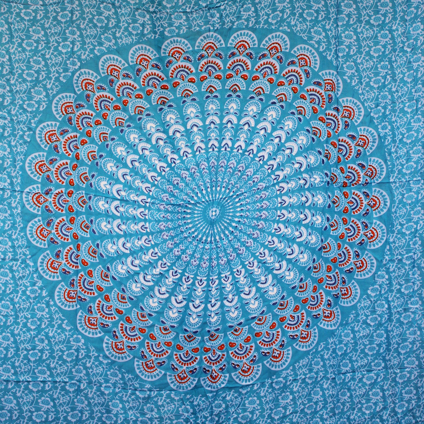 Full circular mandala print on sky blue sarong with floral background and red accents