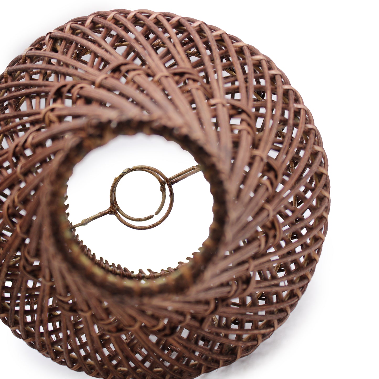Overhead view of rattan table lamp showing intricate handwoven spiral pattern and bulb insert area.