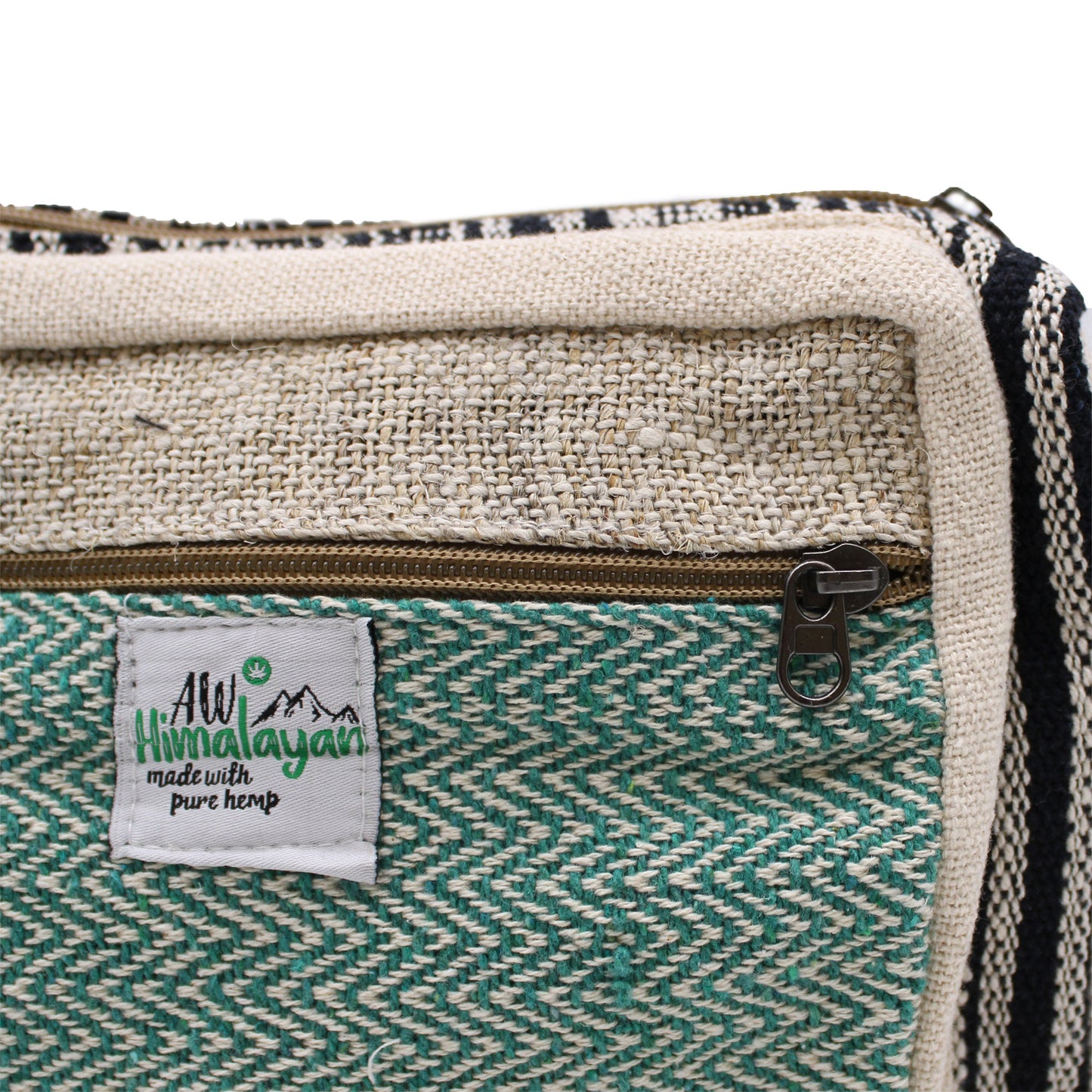 Close-up of hemp messenger bag showing AW Himalayan label and zip, highlighting natural fabric and artisan stitching
