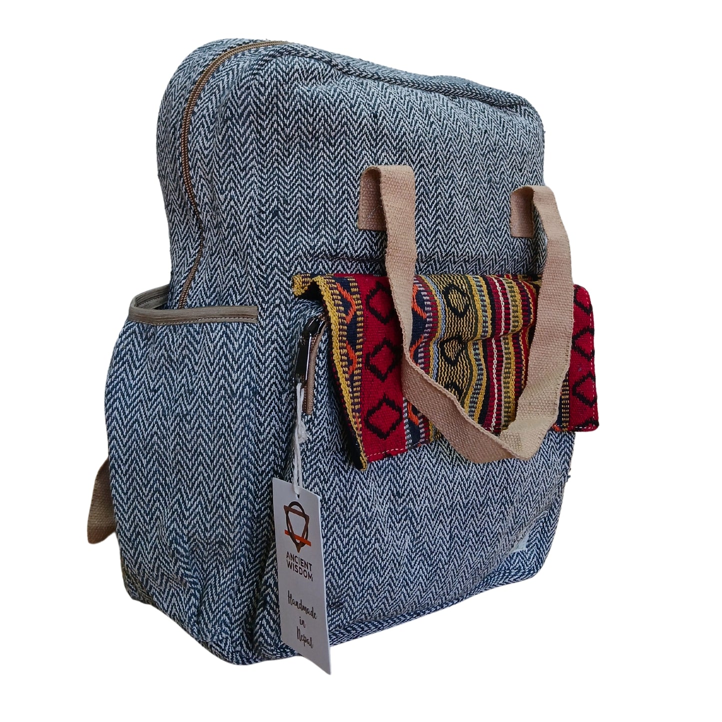 Side angle of the handcrafted Annapurna Backpack with eco-friendly hemp fabric and woven flap