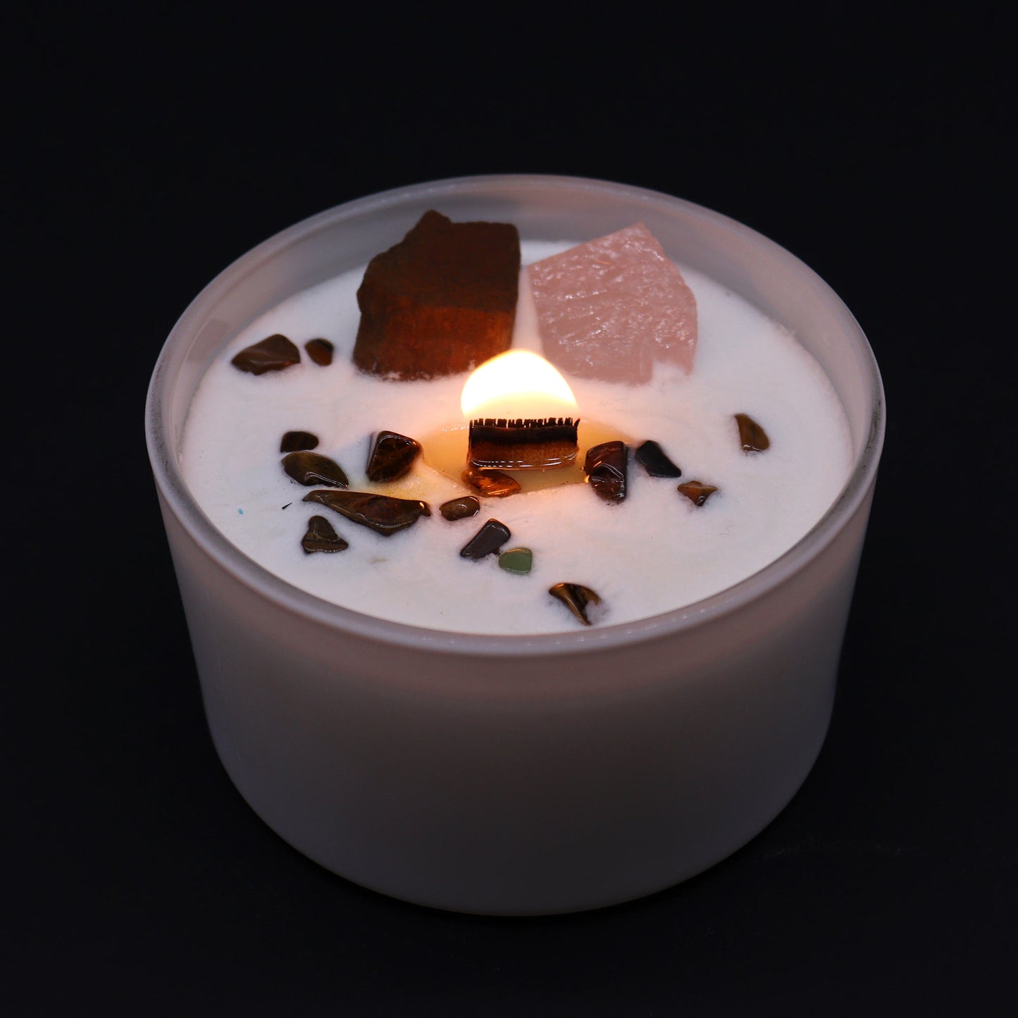 Lit Sacral Chakra Candle with glowing flame and Invoking Dreams scent for creative ritual