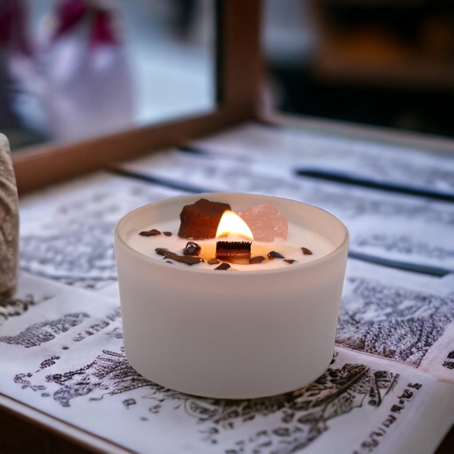 Sacral Chakra Candle displayed in sacred space setting with altar tools and sensual ambiance