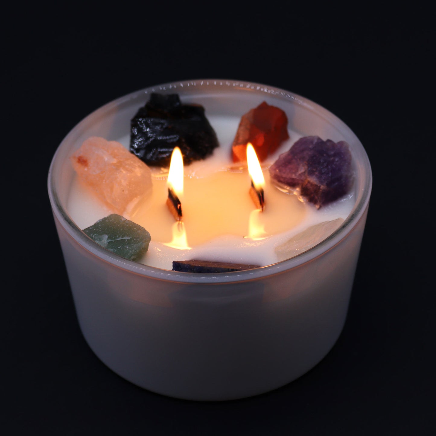 Lit Seven Chakra Harmony Candle with Moon Beams fragrance for full-spectrum energy balancing rituals