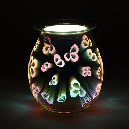 Lit 3D flower petal oil burner glowing in the dark with aromatic wax melting