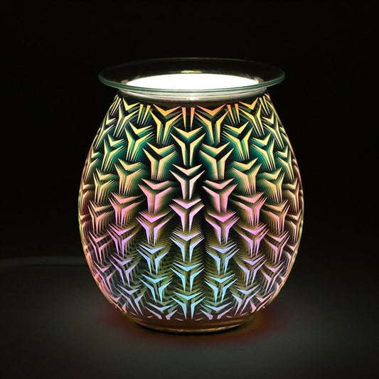 Lit 3D geometric electric oil burner glowing with sacred pattern in the dark