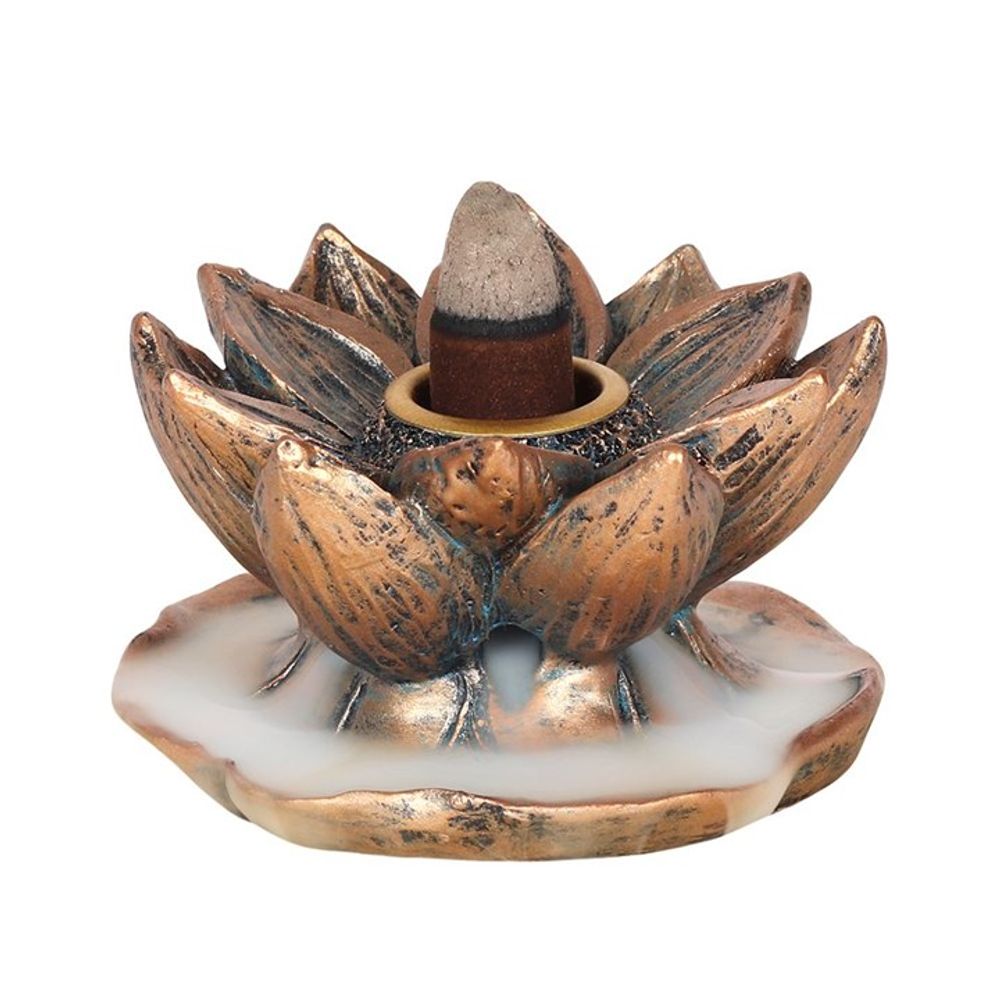 Bronze lotus backflow incense burner in action with smoke cascading down like a waterfall for tranquil, meditative ambiance.