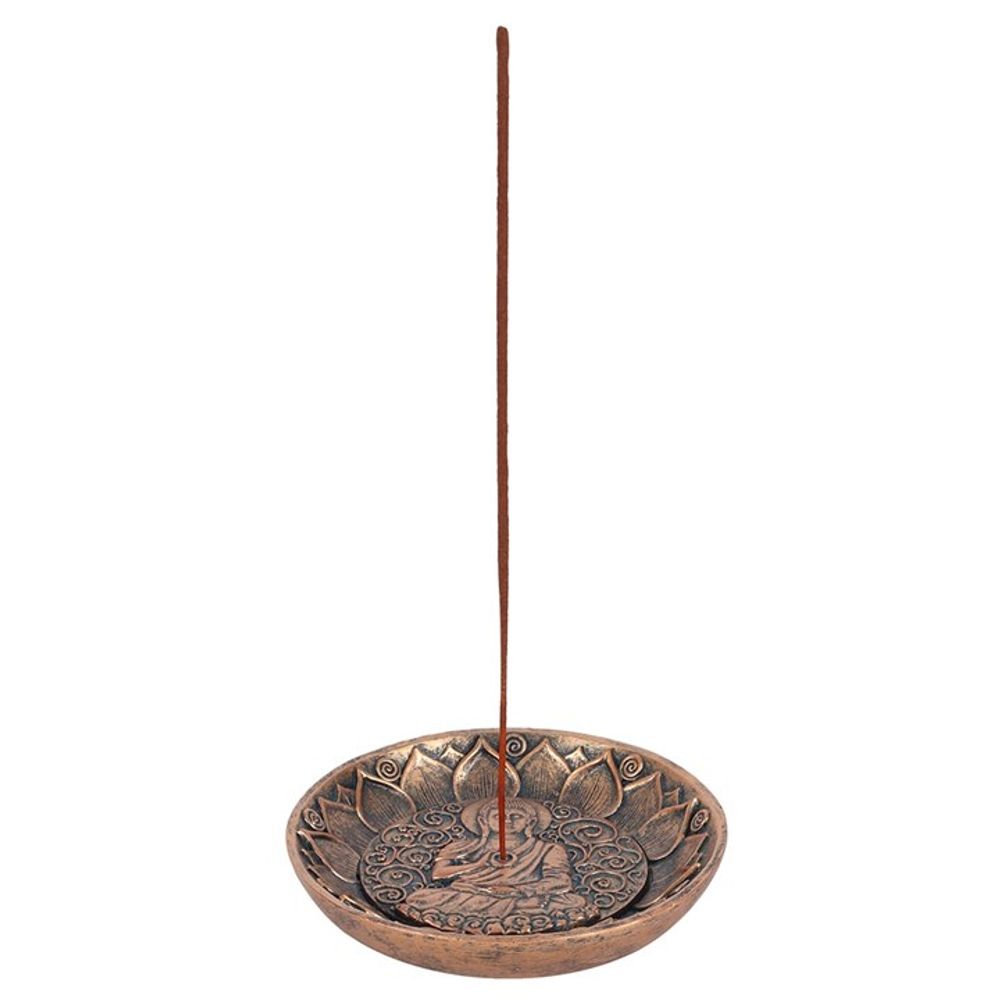 Antique copper Buddha incense holder shown with incense stick upright in use