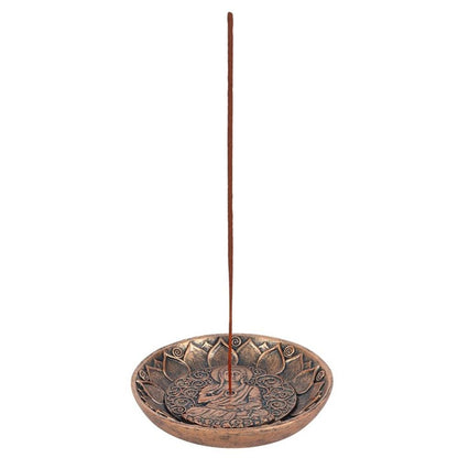 Antique copper Buddha incense holder shown with incense stick upright in use