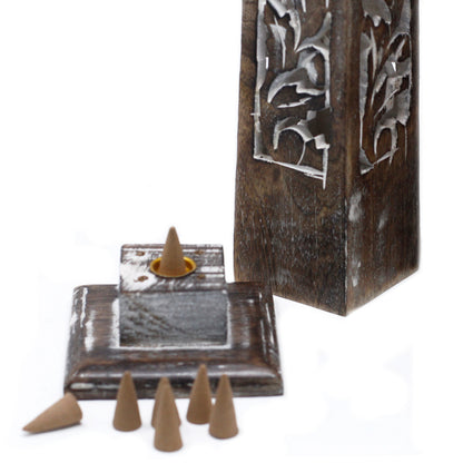 Mango wood incense tower next to matching tray and cone burner, styled in side angle view with traditional craftsmanship.