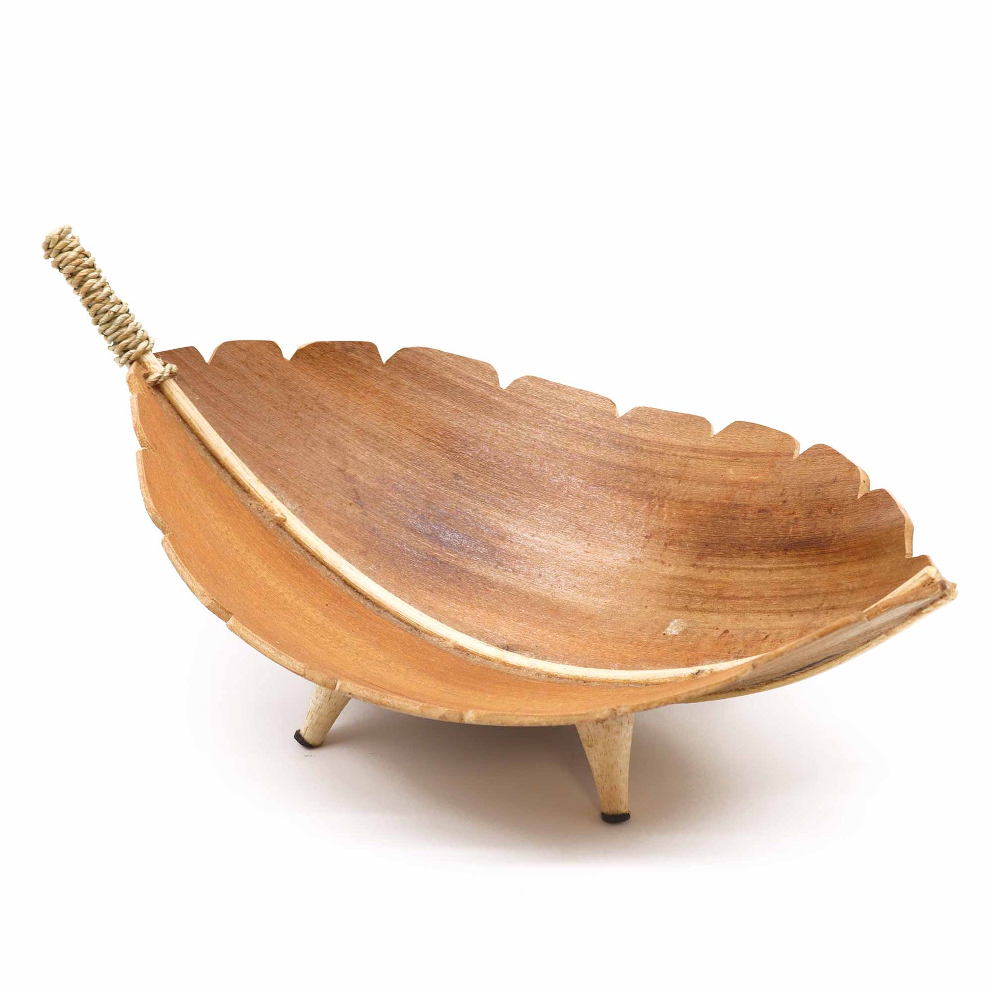 Large handcrafted fruit bowl made from coconut leaf with curved organic shape, sustainable and eco-friendly for home display.