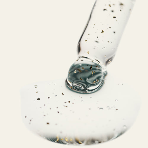 Close-up of a glass with speckled design on a white background
