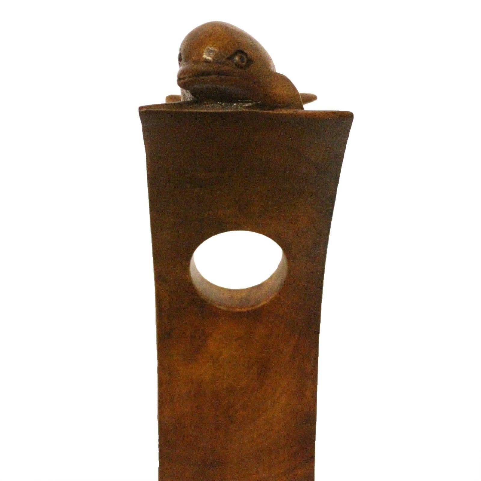 Front-side view of dolphin wooden wine holder balancing a green wine bottle.