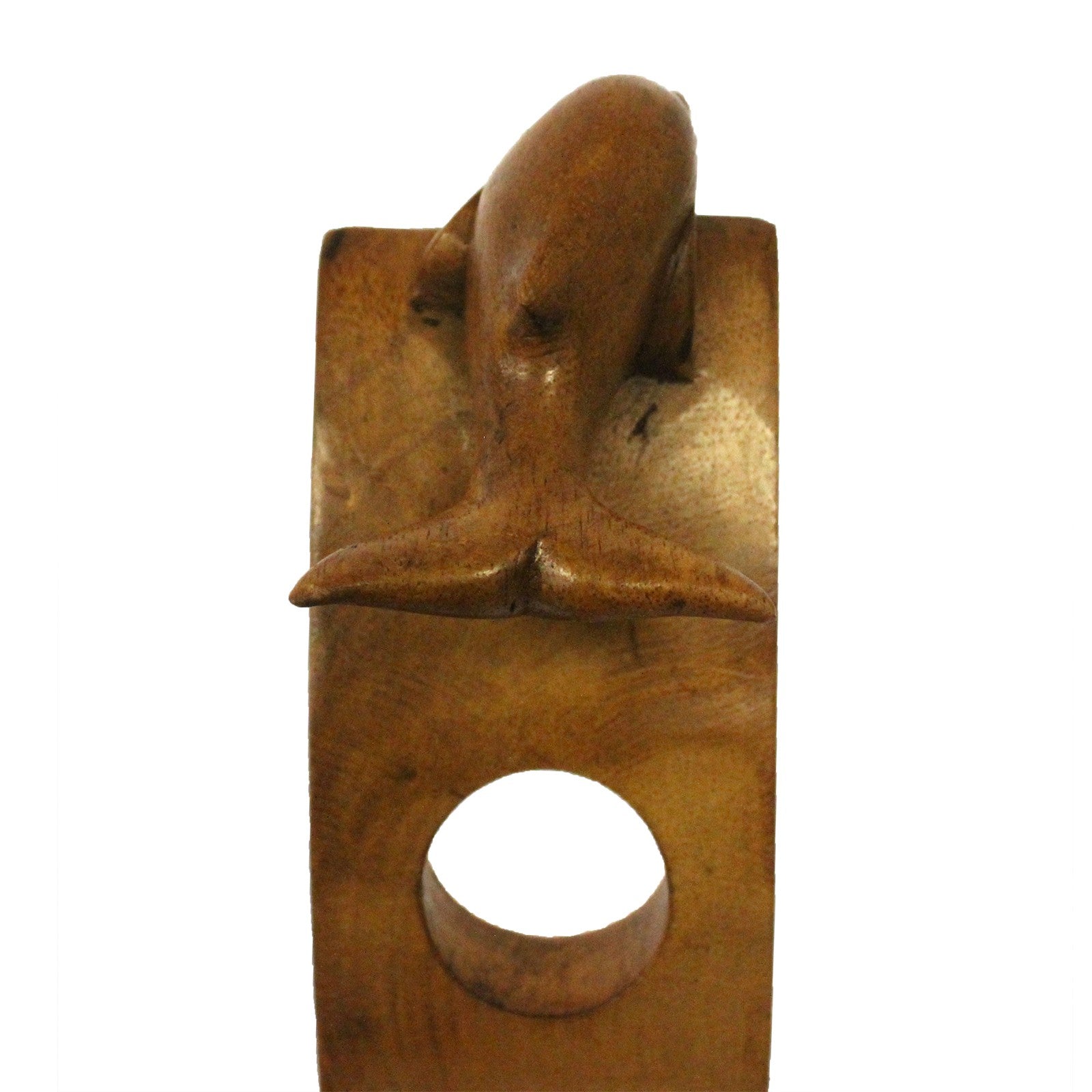 back-side view of dolphin wooden wine holder balancing a green wine bottle.
