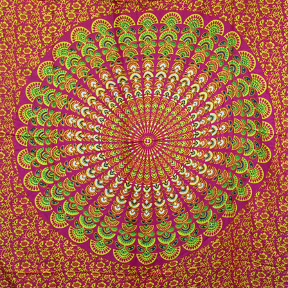 Laid flat fuchsia sarong featuring large circular mandala in lime, yellow, and green tones