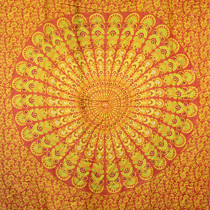 Circular mandala design in orange, yellow, and lime on full laid-out sarong with floral background