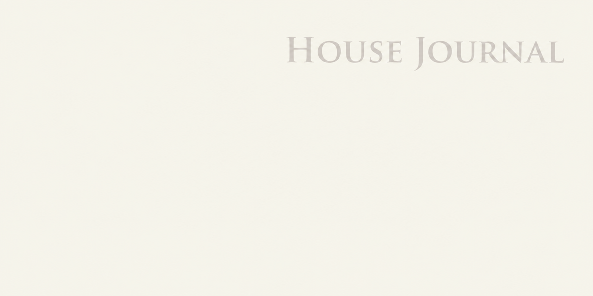 A minimalist cream-colored cover with the text 'HOUSE JOURNAL' printed in a light gray serif font near the top right.