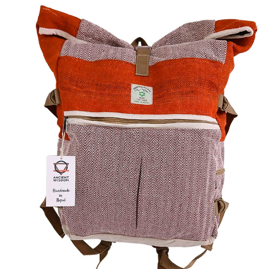 Front-facing view of Himalayan Sunset Orange hemp roll-top backpack with herringbone design