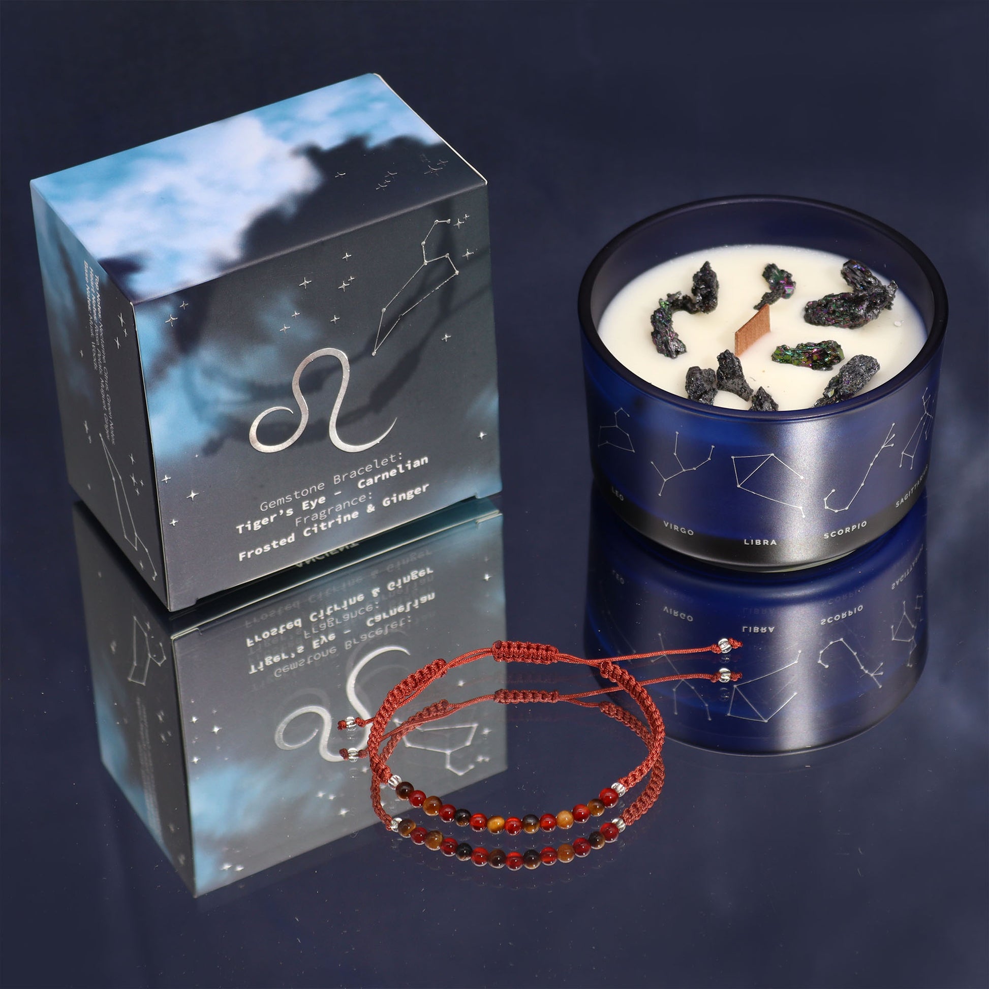 Front view of Leo zodiac candle and gemstone bracelet gift set with tiger’s eye and carnelian, styled with celestial-themed packaging