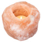 Glowing Himalayan salt candle holder with warm amber light, ideal for calming atmosphere and natural ionization.