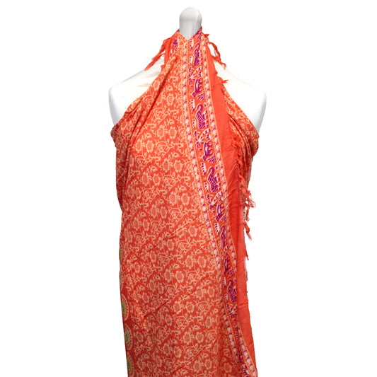 Lightweight rayon sarong in orange with mandala print, tied halter-style on mannequin