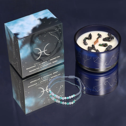 Front view of Pisces zodiac candle and gemstone bracelet gift set with moonstone and aquamarine, featuring celestial-themed box design