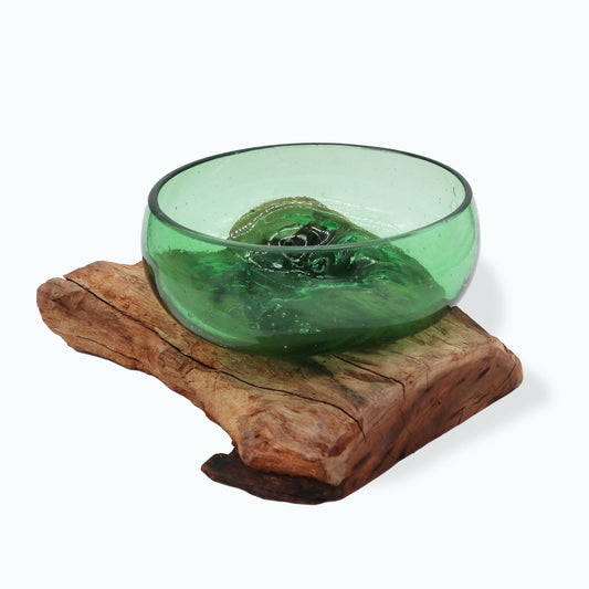  Large handmade glass bowl melted over natural wood base, crafted from upcycled beer bottles for sustainable table decor.