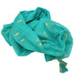 Turquoise cotton pario with hand-painted gold fish design and tassel accents, soft and folded