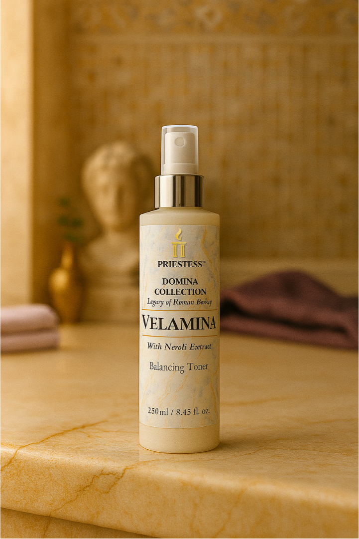 Velamina bottle on a marble surface with a classical statue in the background