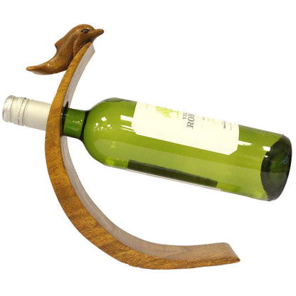 Hand-carved wooden Dolphin balance wine holder with wine bottle on curved base