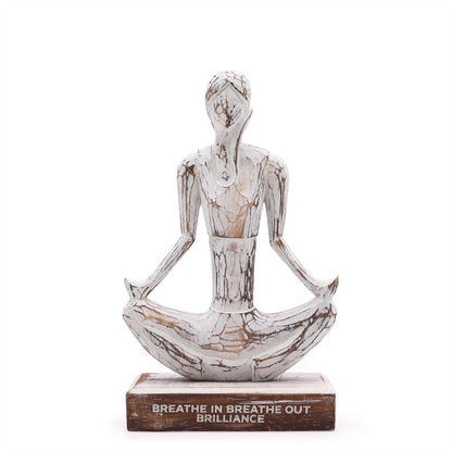 Hand-carved wooden sculpture of a woman in Easy Pose yoga posture, shown from an angled front view for calm and mindful interior decor.