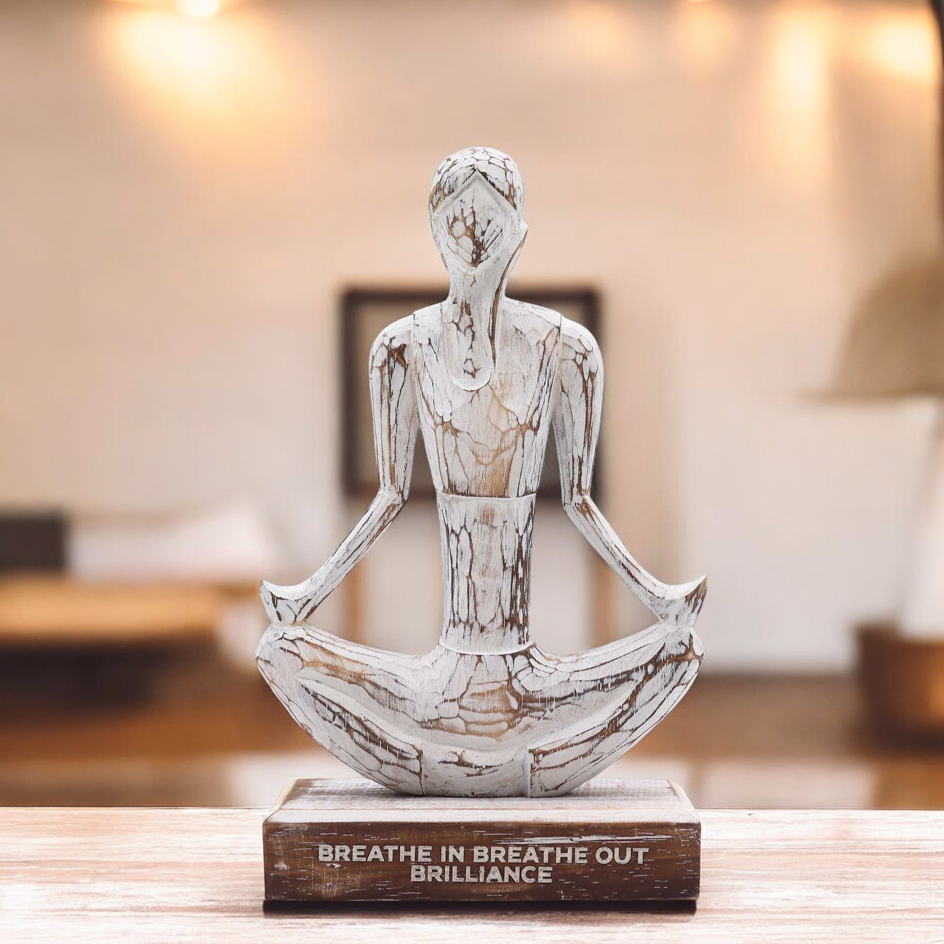 Wooden yoga sculpture displayed in a modern living room, adding a peaceful and spiritual touch to mindful home design.