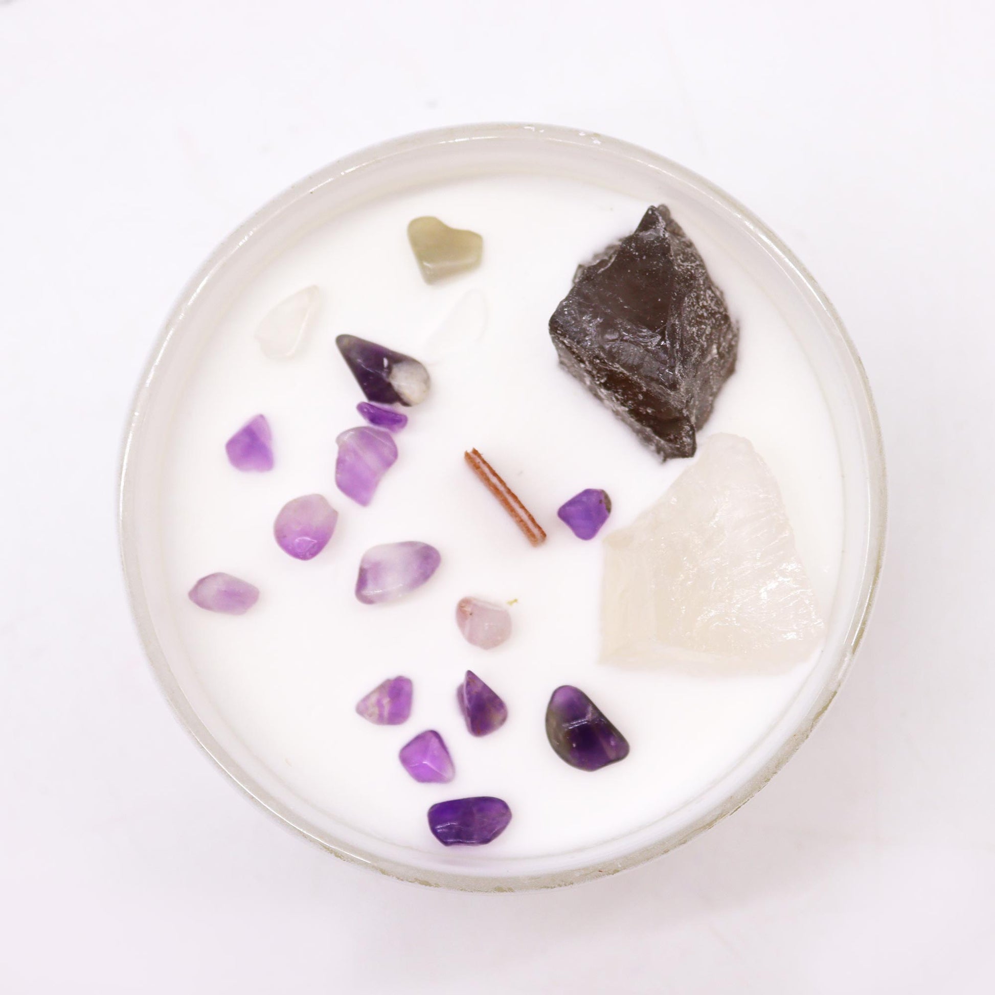 Top view of Crown Chakra Candle showing embedded Celestite and Selenite in soy wax