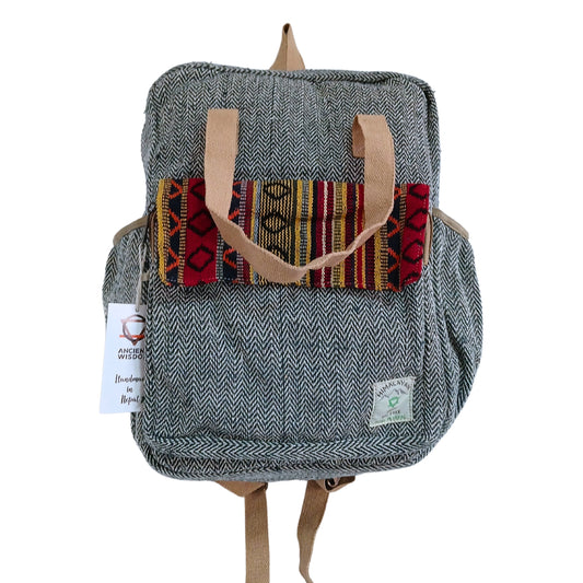 Front view of the Annapurna Hemp Adventure Backpack with red and gold tribal flap, handmade in Nepal