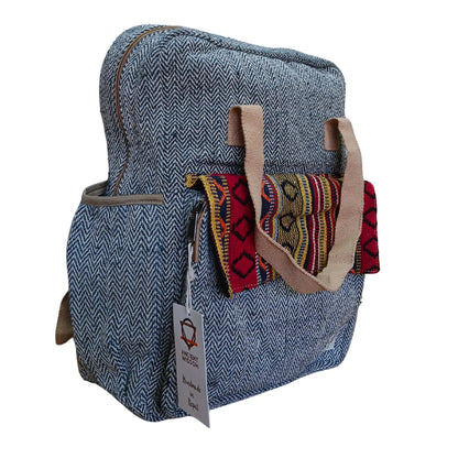 Side angle of the handcrafted Annapurna Backpack with eco-friendly hemp fabric and woven flap