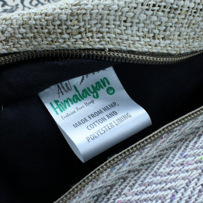 Close-up of inner label on hemp backpack showing hemp, cotton, and polyester lining construction for durability and structure