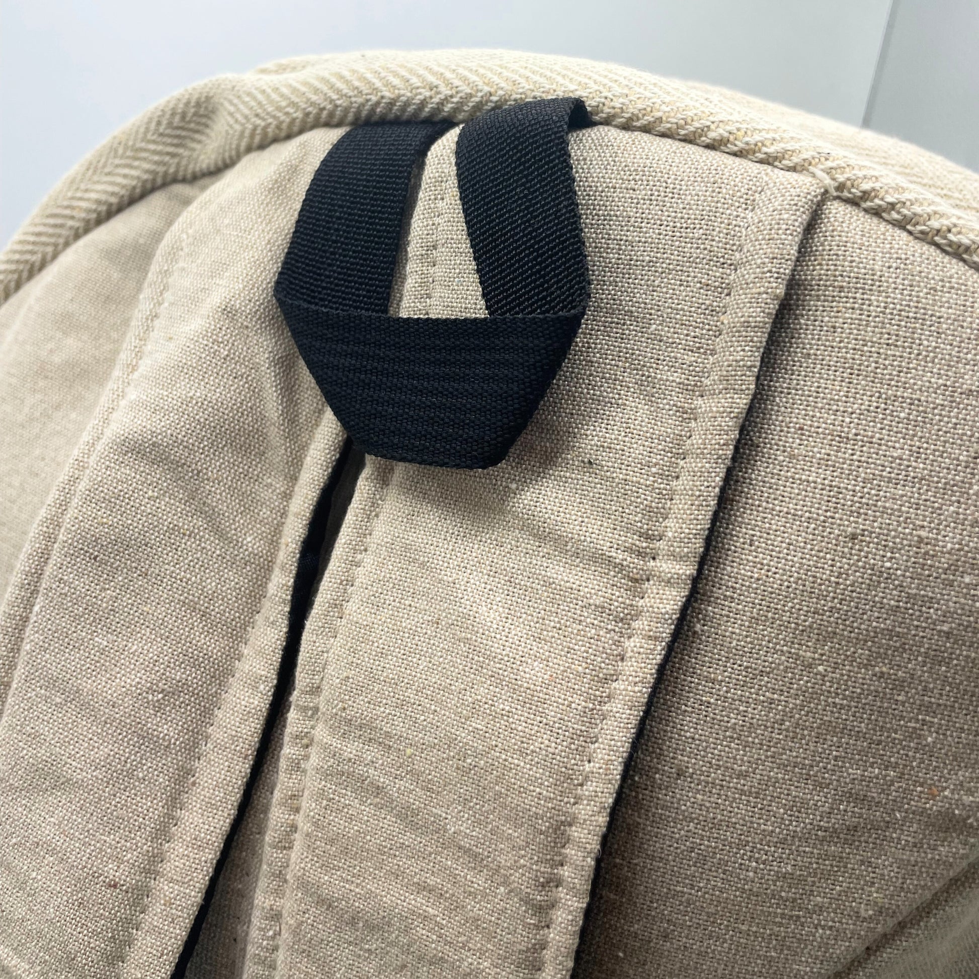 Reinforced back straps and top loop on large 7 chakra hemp backpack, designed for durable daily carry