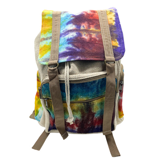 Large square hemp backpack with rainbow tie-dye flap and brown straps, handmade in Nepal for eco-conscious travel and daily use