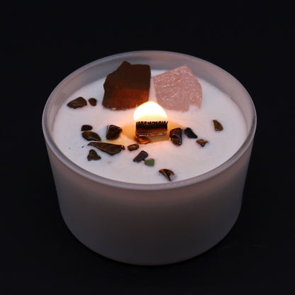 	Lit Sacral Chakra Candle with glowing flame and Invoking Dreams scent for creative ritual