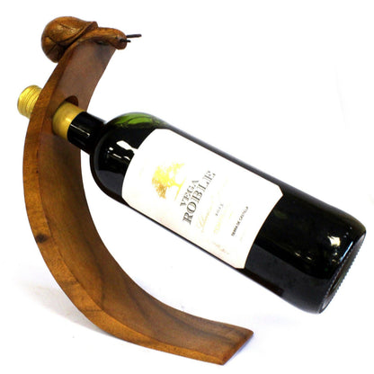 snail-shaped wooden wine holder with a central hole, eco-resin finish.