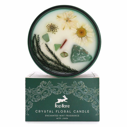 Top view of The Magician Candle showing green soy wax, embedded Jade crystals, and floral details