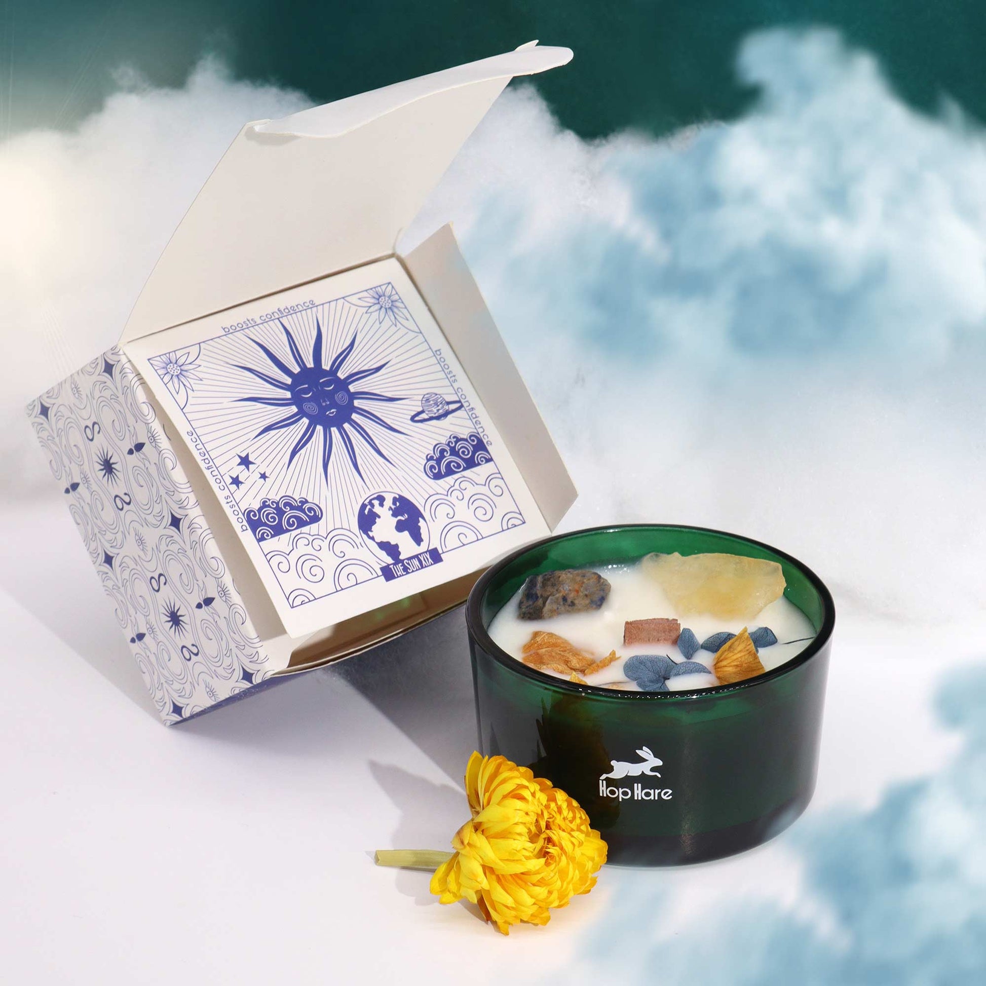 The Sun Candle styled in a sacred setting with crystals, citrus elements, and a solar-inspired altar aesthetic
