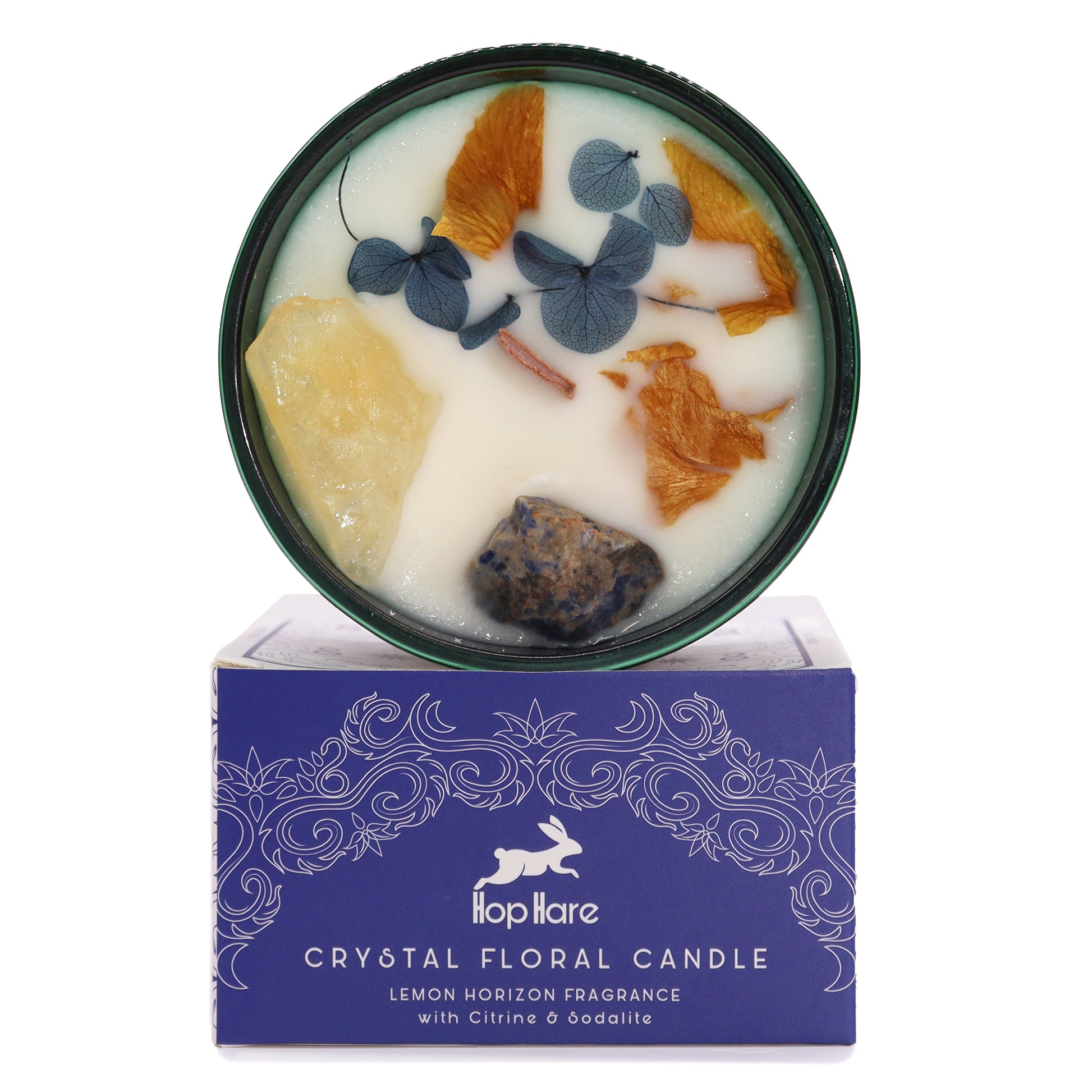 Top view of The Sun Candle showing vibrant soy wax, dried flowers, and citrine crystals