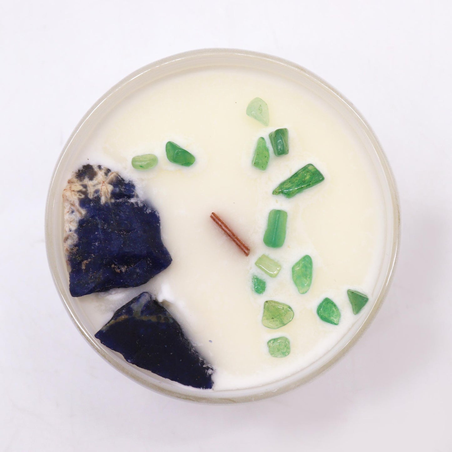 Top view of Throat Chakra Candle showing embedded crystals and blue soy wax for chakra healing