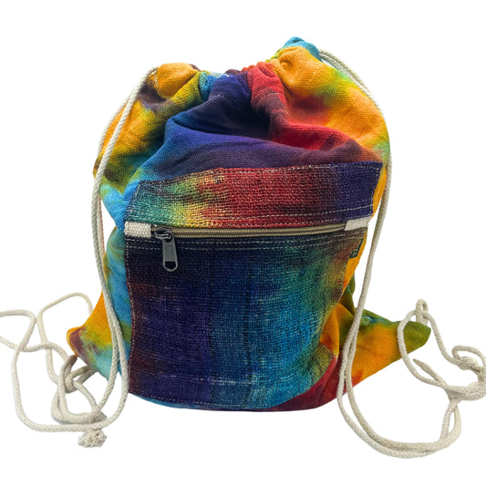 Front view of handmade tie-dye hemp drawstring backpack with front zip pocket and white cord straps, eco-friendly and bold